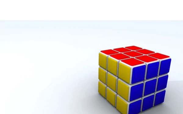A colorful Rubik's Cube sits against a minimalist background, creating an engaging desktop wallpaper that highlights its intricate design and vibrant colors.