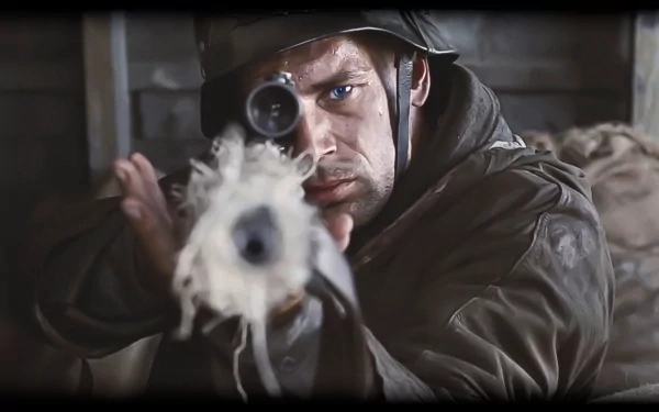 A soldier with a sniper rifle aims intently, capturing the intensity of World War II. Inspired by Saving Private Ryan, this HD wallpaper evokes military valor and determination.
