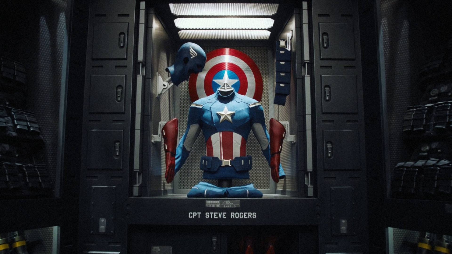 A detailed HD wallpaper featuring Captain America's iconic suit and shield, prominently displaying CPT STEVE ROGERS, set against a striking Avengers backdrop.