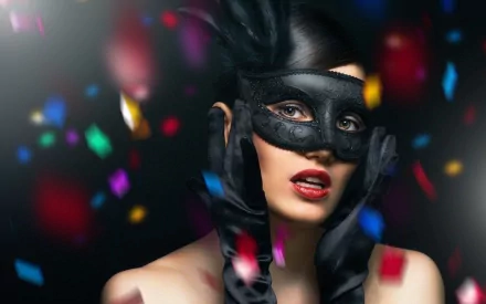 HD photography of a woman wearing a black mask and gloves, surrounded by vibrant, colorful confetti, designed as a striking PC desktop wallpaper background.