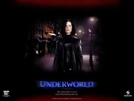 HD desktop wallpaper featuring Kate Beckinsale as Selene from the movie Underworld, set against a dark, urban nightscape with the film title prominently displayed.