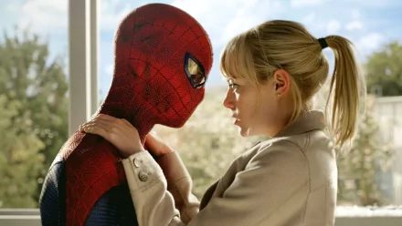Emma Stone as Gwen Stacy shares an intimate moment with Spider-Man in this HD wallpaper from *The Amazing Spider-Man*, capturing their iconic on-screen connection.