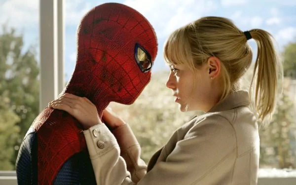 Emma Stone as Gwen Stacy shares an intimate moment with Spider-Man in this HD wallpaper from *The Amazing Spider-Man*, capturing their iconic on-screen connection.