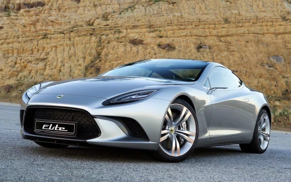 A sleek silver Lotus sports car parked on a road with a rocky cliff backdrop, presented as an HD PC desktop wallpaper and background.