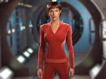 HD PC desktop wallpaper featuring a character from the TV show Star Trek: Enterprise, standing confidently in a futuristic corridor.