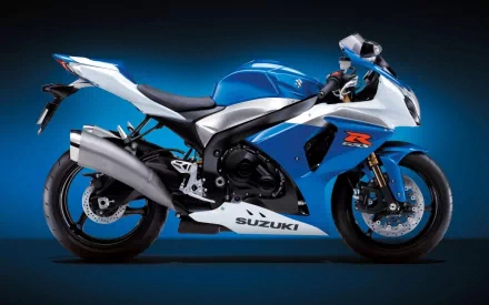 HD PC desktop wallpaper: blue Suzuki sport motorcycle (bike) vehicle on a dark gradient background.