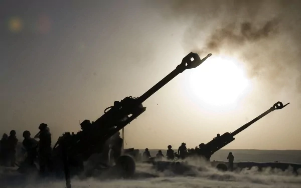 HD desktop wallpaper showing soldiers operating artillery guns amid smoky battlefield atmosphere.
