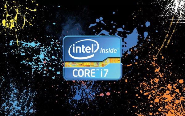 HD PC desktop wallpaper featuring the Intel Core i7 logo with vibrant, colorful paint splatters on a dark technology-themed background.
