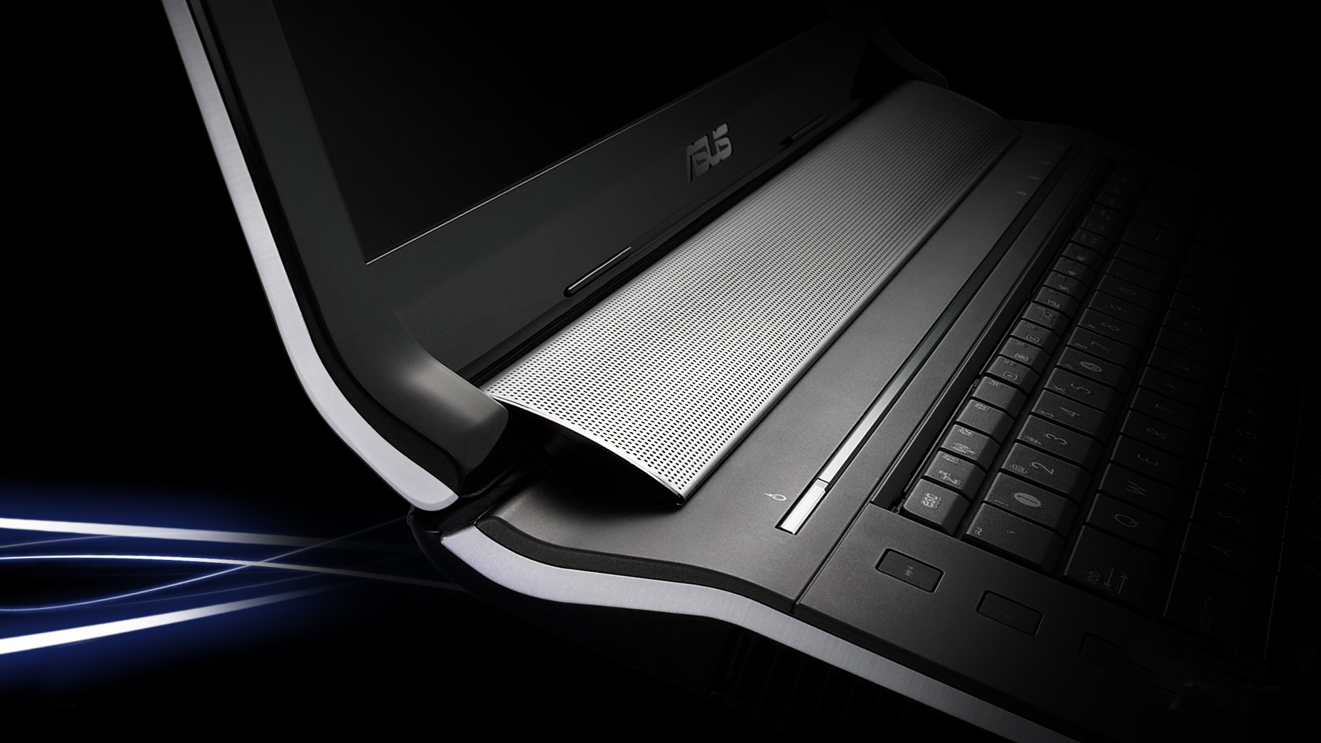 Close-up of an Asus laptop keyboard and hinge, captured with dramatic lighting, showcasing sleek technology in an HD PC desktop wallpaper.