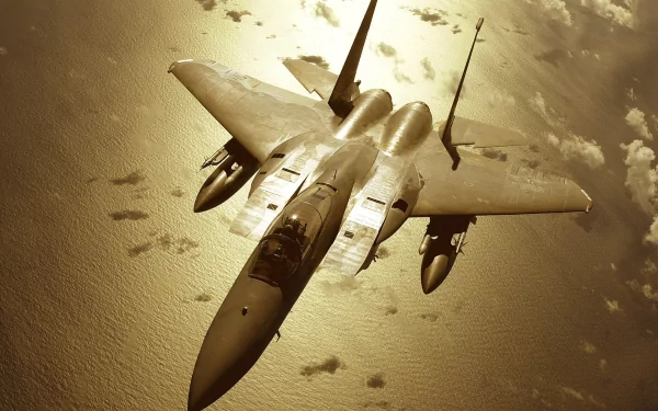 An aerial view of a McDonnell Douglas F-15 Eagle soaring above shimmering waters, showcasing the power and elegance of military aviation with a sleek, powerful design.