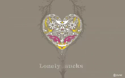 A decorative HD wallpaper featuring a heart design with vibrant colors and intricate patterns, accompanied by the text Lonely sucks, branded with the Zune logo.