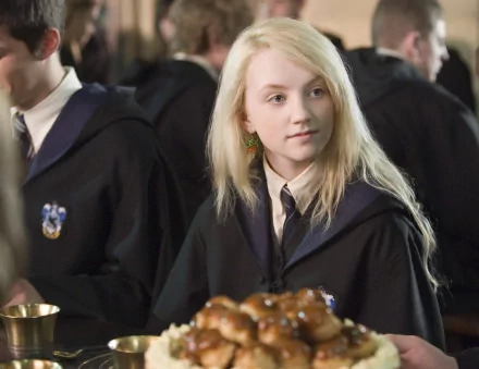 Luna Lovegood from Harry Potter and the Order of the Phoenix is captured in this HD desktop wallpaper, showcasing her unique charm in a vibrant dining scene.