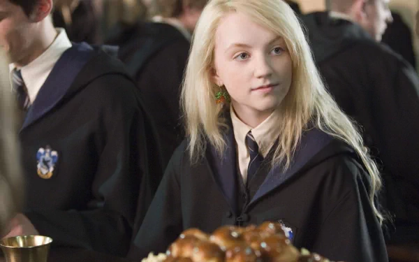 Luna Lovegood from Harry Potter and the Order of the Phoenix is captured in this HD desktop wallpaper, showcasing her unique charm in a vibrant dining scene.