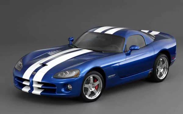 A striking blue Dodge sports car with white racing stripes, showcased in a sleek design, serves as an HD desktop wallpaper and background for car enthusiasts.