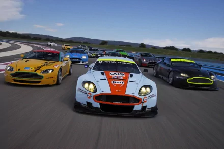 HD wallpaper featuring a thrilling race of Aston Martin DBR9 vehicles on a track, with various colored Aston Martins showcasing their speed and elegance under a clear blue sky.