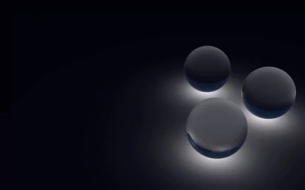 Abstract spheres softly illuminated against a dark background, creating a sleek and modern aesthetic. This high-definition image serves as a striking desktop wallpaper.