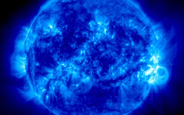 A striking blue representation of the sun, showcasing dynamic solar activity. This HD sci-fi wallpaper offers a captivating cosmic backdrop for your desktop.