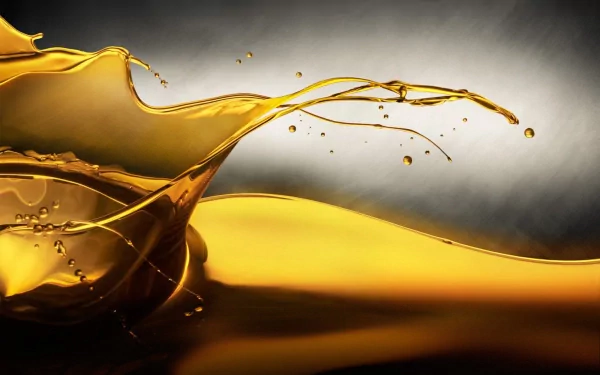 HD desktop wallpaper featuring an artistic depiction of flowing golden liquid, set against a gradient background with an elemental feel.