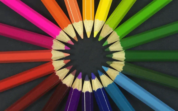 HD desktop background featuring a vibrant circular arrangement of colored pencils, showcasing a full spectrum of colors against a black backdrop.