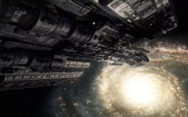 A stunning HD desktop wallpaper featuring a spacecraft from Stargate SG-1, set against a backdrop of a swirling galaxy and bright celestial light.
