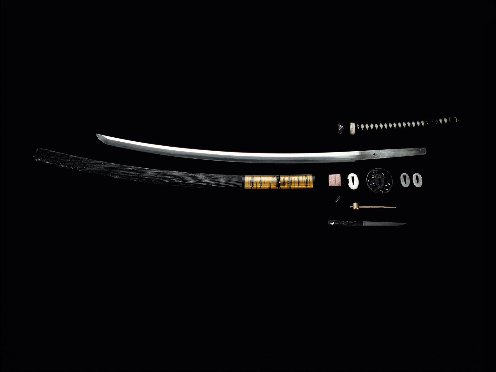 HD PC desktop wallpaper featuring a man-made sword with a sleek blade and intricately detailed handle against a black background.