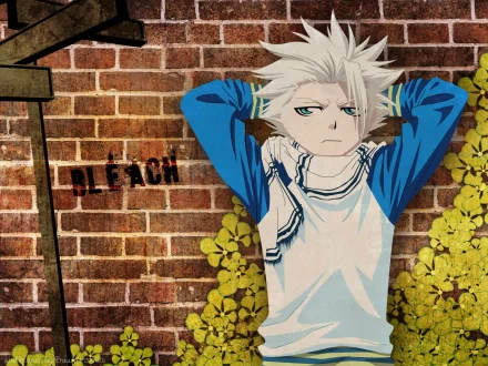A high-definition desktop wallpaper featuring Tōshirō Hitsugaya from the anime *Bleach*, set against a textured brick wall and vibrant greenery.