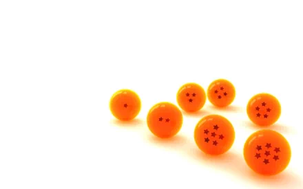 HD Dragon Ball anime desktop wallpaper featuring seven scattered orange Dragon Balls with star markings on a white background.