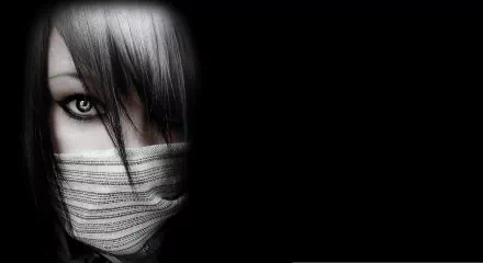 HD desktop wallpaper of a mysterious woman with one intriguing eye visible, half her face covered by a striped cloth, set against a black background.