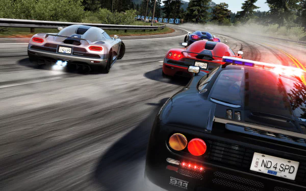 HD PC desktop wallpaper from the video game Need for Speed: Hot Pursuit showing a high-speed chase of supercars with a police cruiser, flashing lights, motion blur and smoky tire marks.