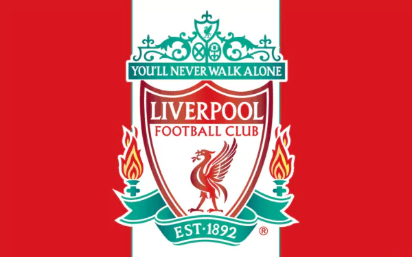 HD desktop wallpaper featuring the Liverpool F.C. crest with the club’s motto and established year on a bold red background.