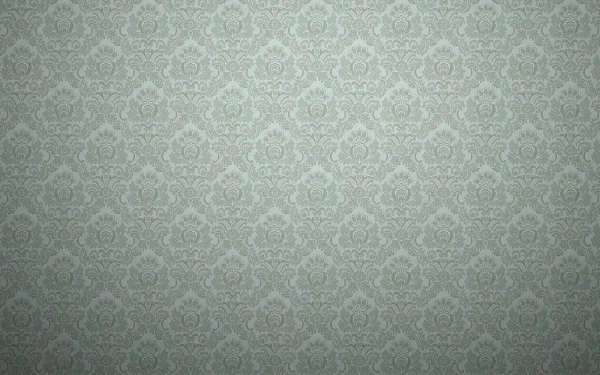 An HD desktop wallpaper with an intricate abstract pattern in subtle green hues, creating a harmonious and elegant background design.