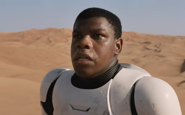 HD desktop wallpaper featuring John Boyega as Finn from Star Wars Episode VII: The Force Awakens in desert terrain wearing stormtrooper armor.