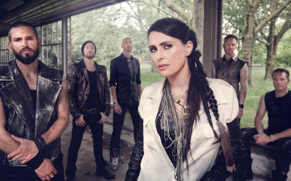 HD PC desktop wallpaper of a female-fronted symphonic metal band posing beneath a pavilion in moody woods; music — Within Temptation–inspired.