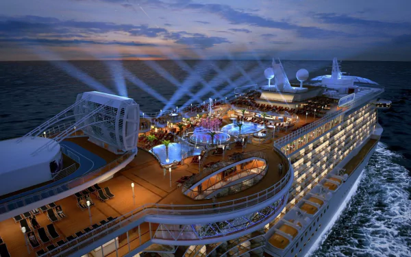 HD desktop wallpaper of the MS Royal Princess cruise ship at sea during sunset, showcasing its illuminated decks and outdoor amenities.