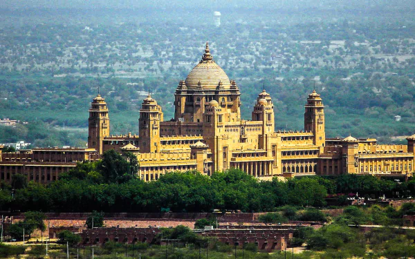 HD desktop wallpaper showcasing the majestic Umaid Bhawan Palace, a grand man-made architectural marvel set against a sprawling natural landscape.