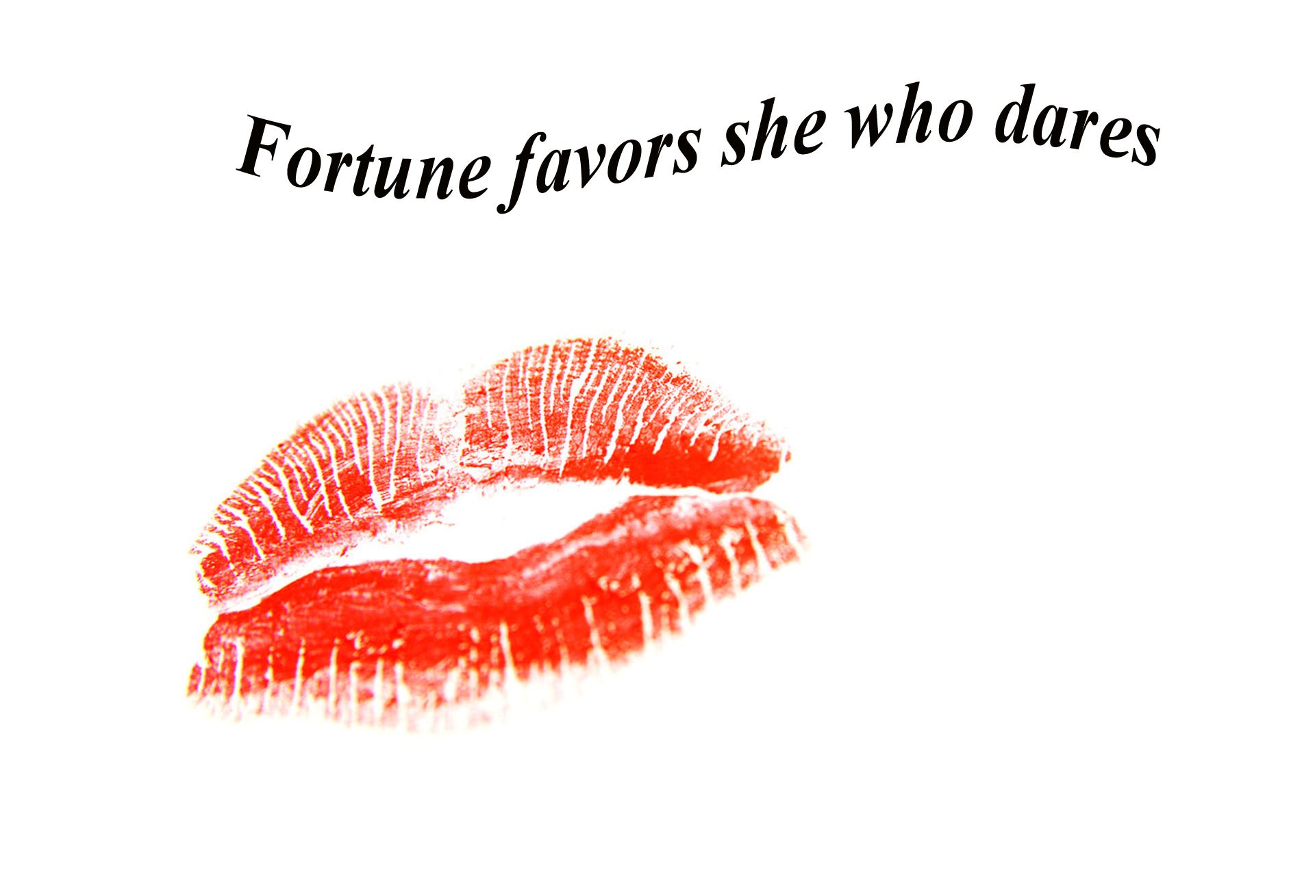 HD PC desktop wallpaper featuring a bold red lipstick kiss mark with the statement Fortune favors she who dares in stylish black text above.