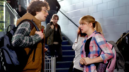 Scene from the movie Kick-Ass 2 featuring two characters in a hallway, presented as a 4K Ultra HD PC desktop wallpaper and background.