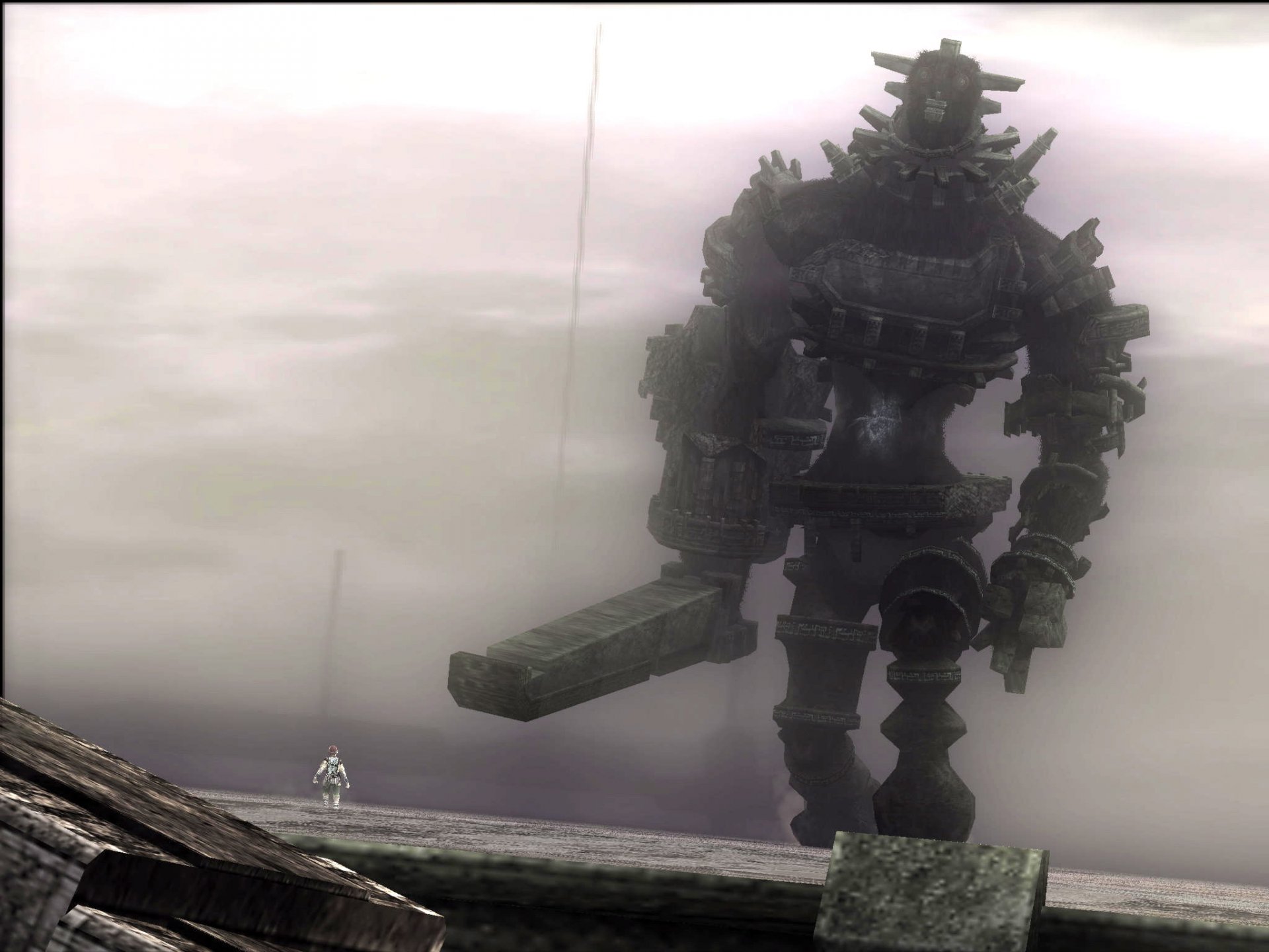 HD wallpaper from the video game Shadow of the Colossus featuring a colossal giant wielding a sword, with a small figure standing in the foreground amidst a foggy landscape.