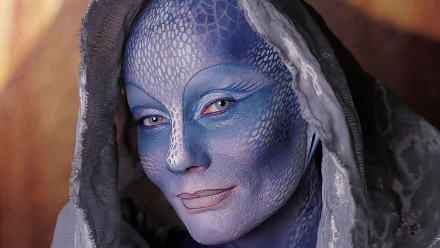 Close-up HD wallpaper of Pa'u Zotoh Zhaan, portrayed by Virginia Hey, from the TV show Farscape, featuring detailed blue makeup and textured skin.
