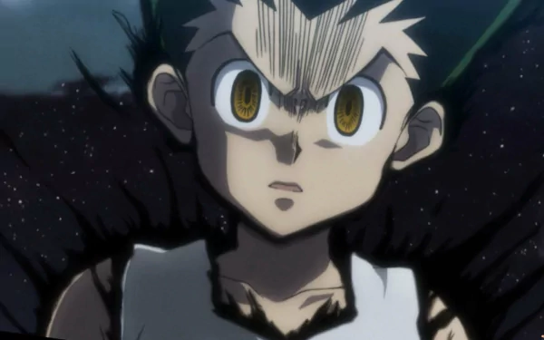 HD wallpaper of Gon Freecss from Hunter x Hunter, intense gaze with a dark background.