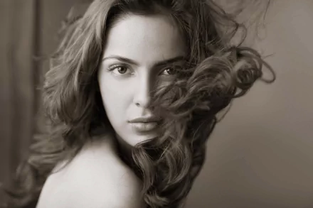 Monochrome close-up of Bollywood celebrity Shazahn Padamsee with flowing curls, captured in an HD PC desktop wallpaper and background.