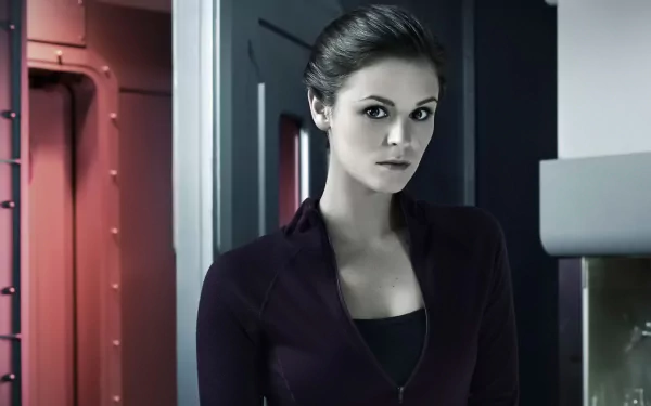 HD wallpaper of a woman in a purple top standing in a Helix-themed, futuristic setting, suitable as a desktop background.