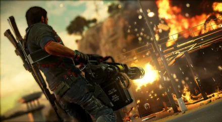 Rico Rodriguez from Just Cause 3 wields a heavy weapon amid explosions in this HD PC desktop wallpaper capturing intense video game action.