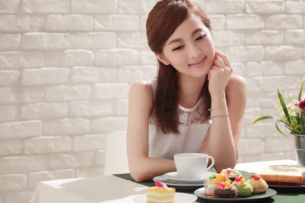 A smiling Asian woman enjoys a colorful meal at a table, surrounded by desserts, in a bright, inviting setting. Perfecting a joyful moment in Taiwanese cuisine.