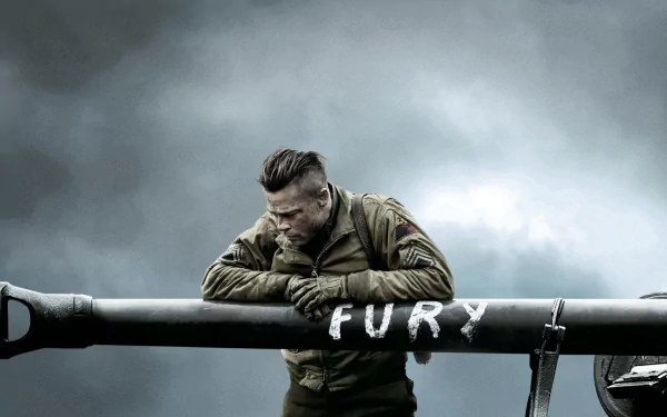 HD desktop wallpaper featuring a soldier leaning on a tank barrel with FURY painted on it, inspired by the movie Fury, set against a cloudy, dramatic sky.