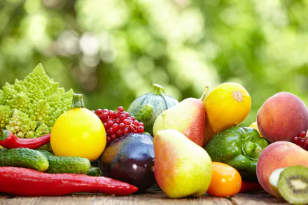 Vibrant assortment of fresh fruits and vegetables displayed in sharp 4K Ultra HD quality, bright and colorful against a blurred natural green background.