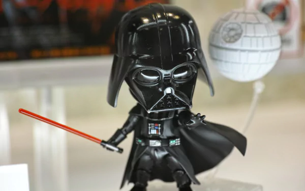 A detailed 4K Ultra HD image of a Darth Vader figure, complete with a red lightsaber and the Death Star in the background, capturing the essence of Sci-Fi from the Star Wars universe.
