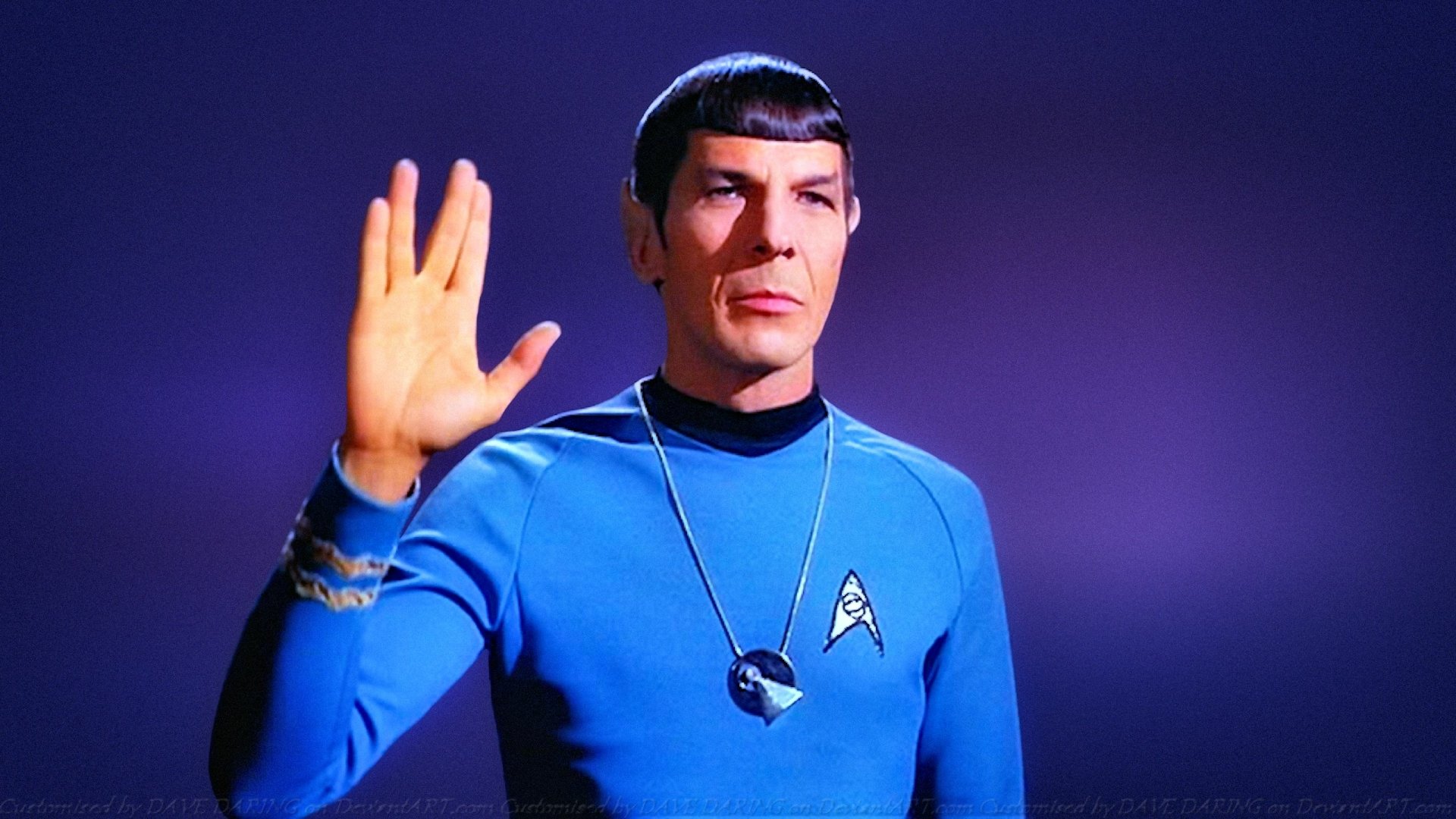 A high-definition wallpaper featuring Spock from Star Trek: The Original Series, with his iconic Vulcan salute and classic blue uniform against a simple purple background.