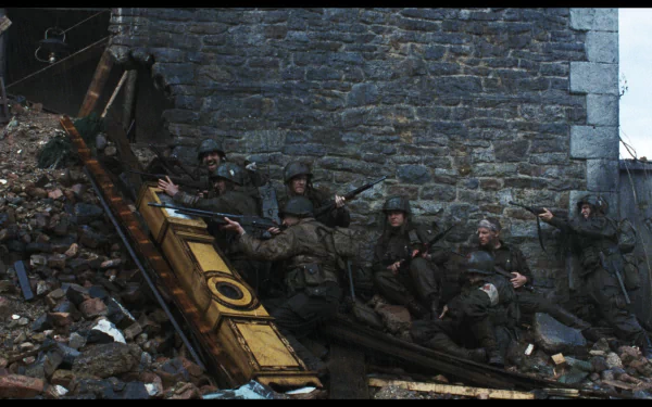 A dramatic scene from Saving Private Ryan, featuring soldiers taking cover amid rubble, capturing the intense atmosphere of war. An evocative HD wallpaper for your desktop.