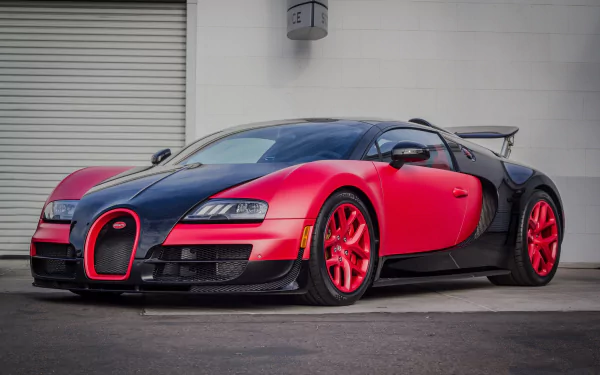 HD desktop wallpaper featuring a Bugatti Veyron 16.4 Grand Sport in striking red and black, showcasing the iconic Bugatti vehicle’s sleek and powerful design.